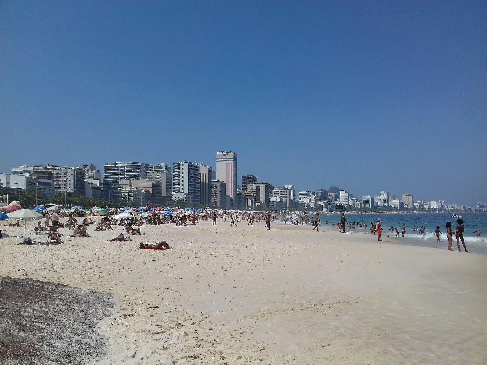 Leblon beach in Rio de Janeiro with the South Zone skyline of apartment buildings behind the sand