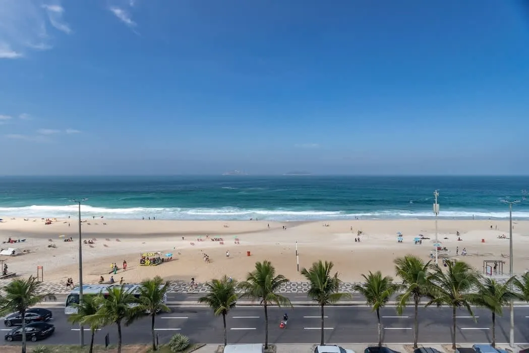 Ipanema beach, the palm-lined promenade and the open Atlantic seen from the windows of the Ipanema Beach Linear Penthouse