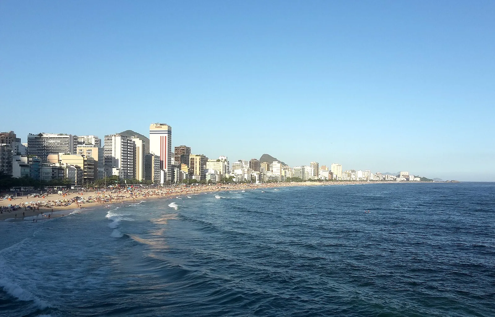 Leblon beach and seafront buildings in late-afternoon light